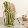 Indulge in the luxurious comfort of the Moss Seed Cotton Throw. Crafted with a supremely soft hand-feel, this throw offers a versatile color and texture that effortlessly enhances any space.