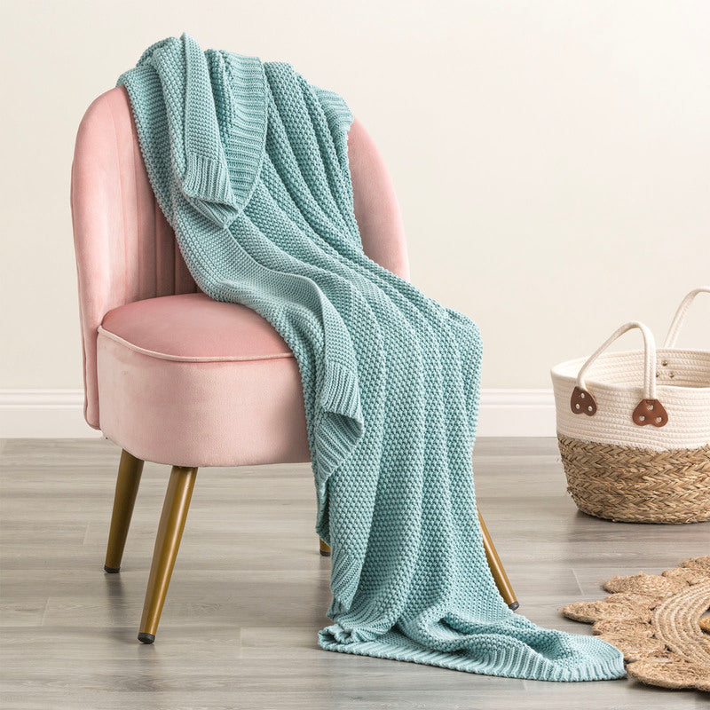 Indulge in the luxurious comfort of the Moss Seed Cotton Throw. Crafted with a supremely soft hand-feel, this throw offers a versatile color and texture that effortlessly enhances any space.