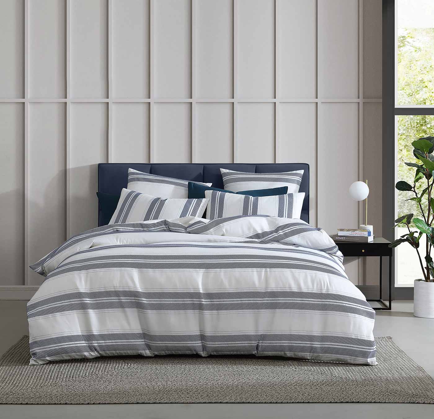 The Cadet Navy Quilt Cover Set provides a relaxed, coastal look in a timeless navy hue. It features large textured stripes for an unmistakable summer feel.