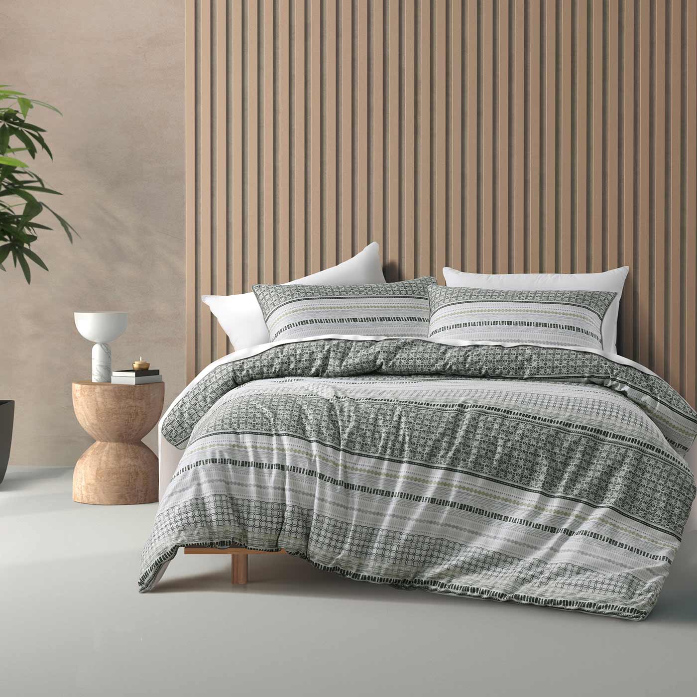 Contemporary and stylish. Drake is printed on luxurious cotton sateen fabric and finished with a piped edge. A modern geometric design in a very on trend green colour way.