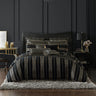Introduce a touch of drama to your bedroom with the Davinci Mateo Gold Bed Quilt Cover Set. This exquisite ensemble commands attention with its bold stripes in black and gold, skillfully woven into softly textured chenille fabric.