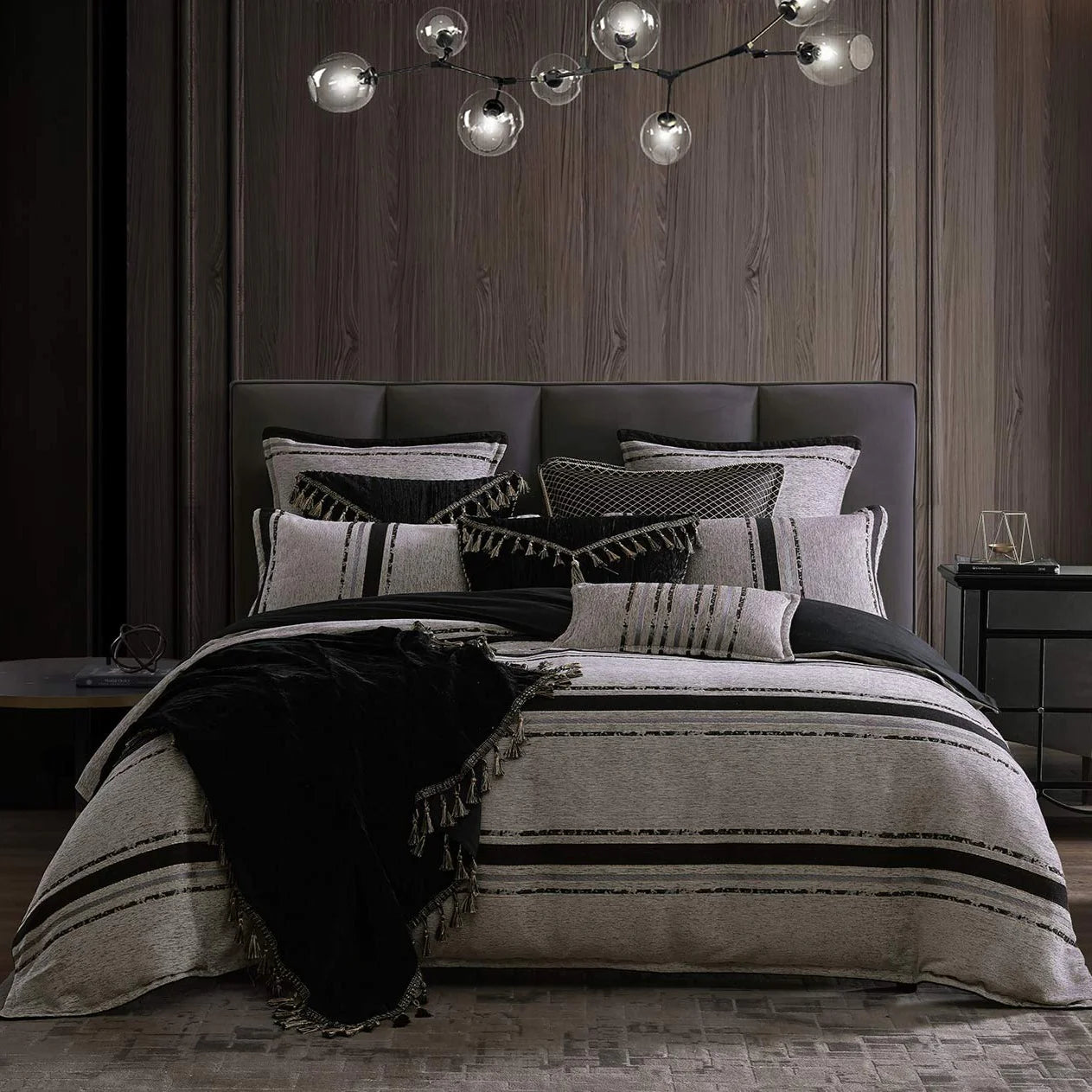Experience the essence of contemporary luxury with Gambusi Smoke. This exquisite design combines the softness and texture of chenille with a captivating interplay of tonal metallic stripes, creating a sophisticated and modern aesthetic.