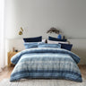Brighten your space this winter with Amata. The use of all blue tones creates a sense of calm. The silky feel of soft cotton sateen fabric is perfect for cuddling up to in bed. Flawless piped edging in white allows for a beautiful contrast.