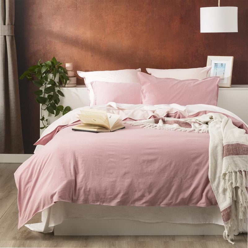 Create an effortlessly cool and inviting bedroom with the Rose Reversible Quilt Cover Set. Crafted from 100% cotton, this set from our Essentials Range offers a perfect blend of breathability and warmth, making it suitable for year-round use. The garment-dyed and stonewashed fabric gives it an airy, soft, and perfectly worn-in feel that will envelop you in comfort.