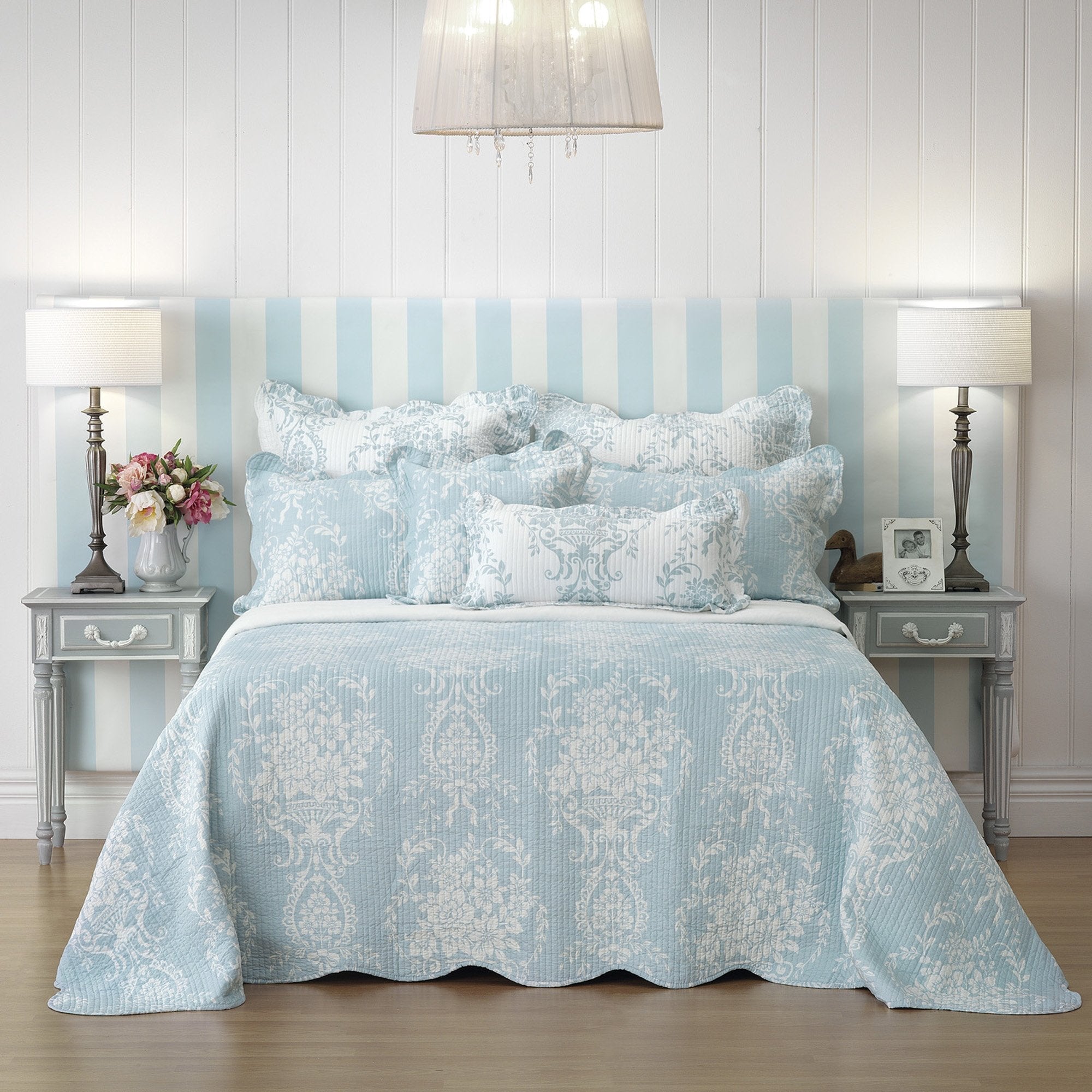 Introducing our exquisite bedspread, infused with the timeless elegance of a French provincial boudoir. Crafted from luxuriously soft textured fabric, this enchanting piece is designed to elevate your bedroom's aesthetic.