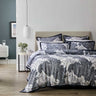 Step into a world of luxurious resort-style living with the Sago Ink Bed Quilt Cover Set from Private Collection. This exquisite set offers a monochromatic escape, immersing you in an atmosphere of opulence. The design showcases oversized hand-drawn elements in striking navy and crisp white, creating a bold and captivating visual statement.