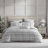Sinclair Silver combines a modern coastal look with the tactile softness of quilted matelasse. A series of horizontal stripes alternate between plains and patterns balanced by the fresh, tonal palette. Self-flanged and piped edges complete the look.