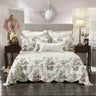 Introduce an air of timeless heritage into your bedroom with our stunning scalloped edge bedspread. Crafted with meticulous attention to detail, this exquisite piece features a classic white background that serves as a canvas for a breath taking array of flowers.