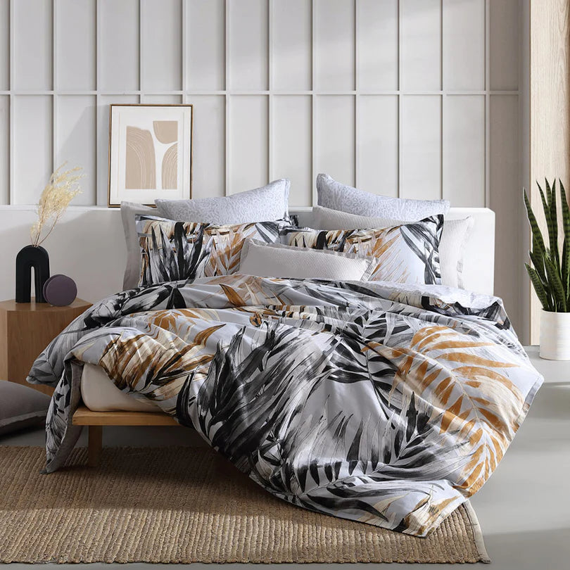 Experience the refined elegance of the Laguna Quilt Cover Set Range Natural by Logan and Mason. This bedding set showcases a sophisticated modern tropical design that exudes charm.