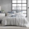 Experience the harmonious blend of soft chenille and a navy and white geometric design in a lineal pattern with the Boston Quilt Cover Set Range White by Logan and Mason Platinum.