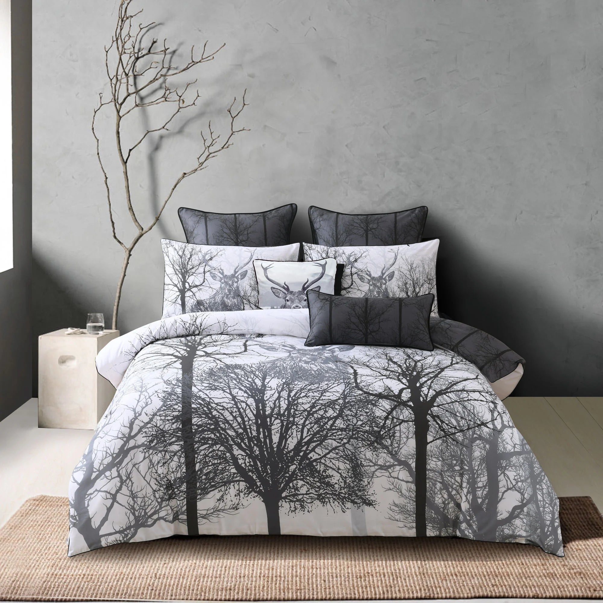Bring the woods back into your home with this on trend design. The design features an amazing stag head emerging from behind the tall trees creating a statement piece for your bedroom. It is printed on easy care fabric and features a coordinate reverse and black piping.