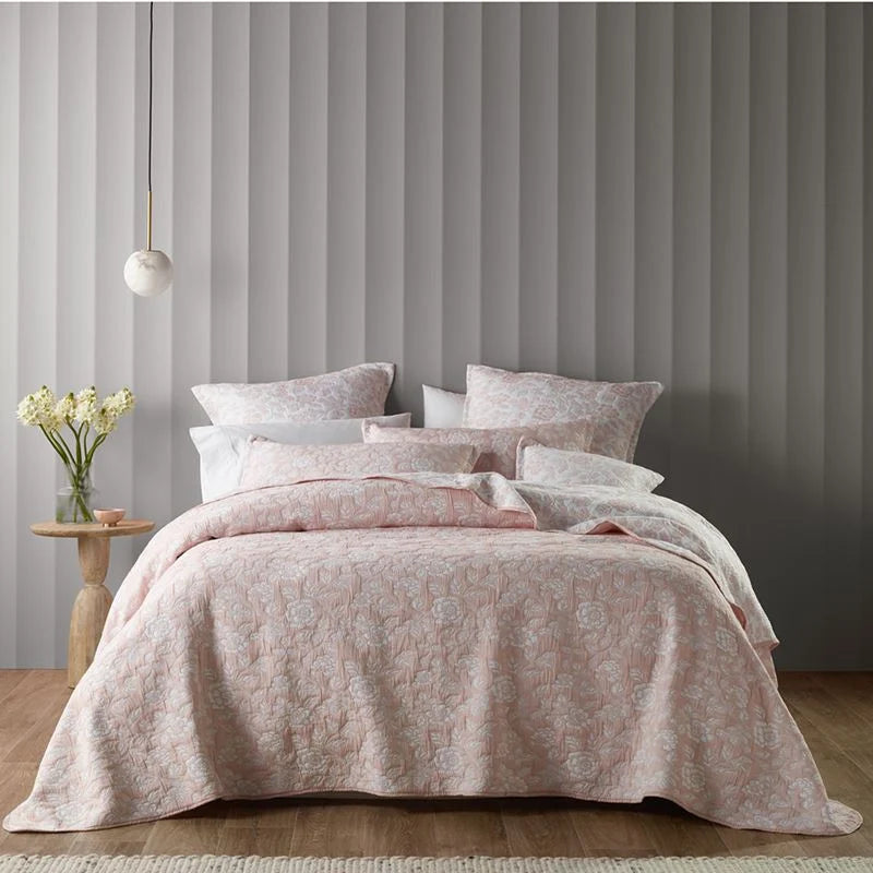 Inspired by a French provincial boudoir. The Provence bedspread features a subtle jacquard floral design in fresh white that contrasts beautifully on a blush background. The pillowcases and cushion are finished with a sophisticated tailored edge. 