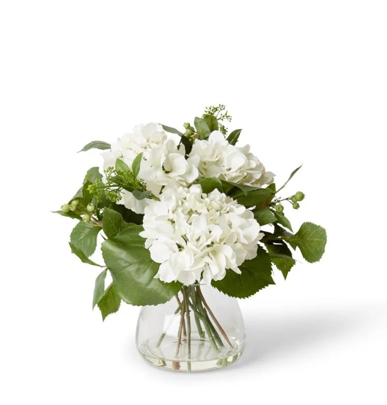 This floral arrangement will surprise everyone with its lifelike appearance, fantastic quality and set in a classic vase