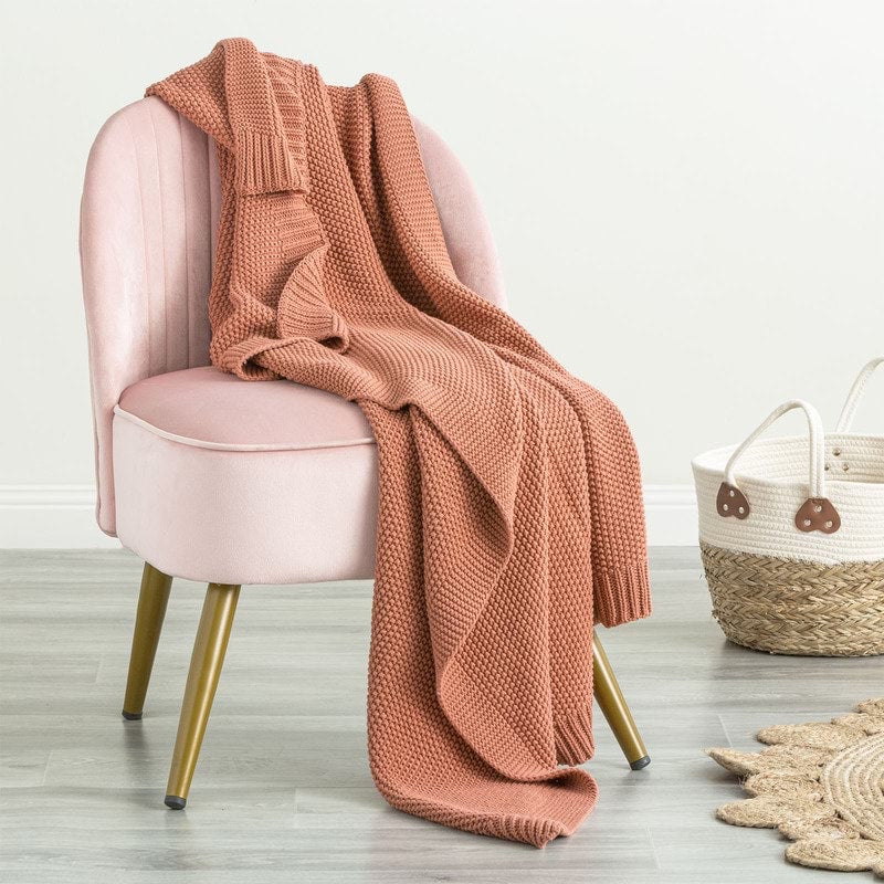 Indulge in the luxurious comfort of the Moss Seed Cotton Throw. Crafted with a supremely soft hand-feel, this throw offers a versatile color and texture that effortlessly enhances any space. 