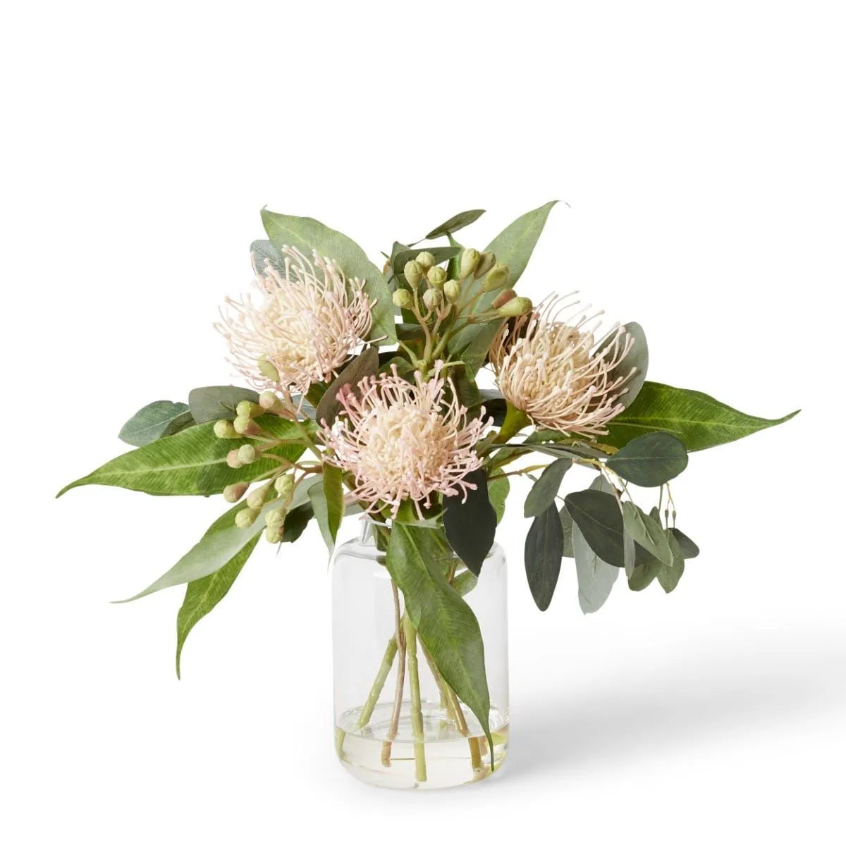 Display the Pin Cushion Bouquet in Tillie Vase in your home to bring lush color and a touch of nature to your space. Crafted with remarkable realism, this 38cm bouquet requires no maintenance, making it a hassle-free addition to your decor.