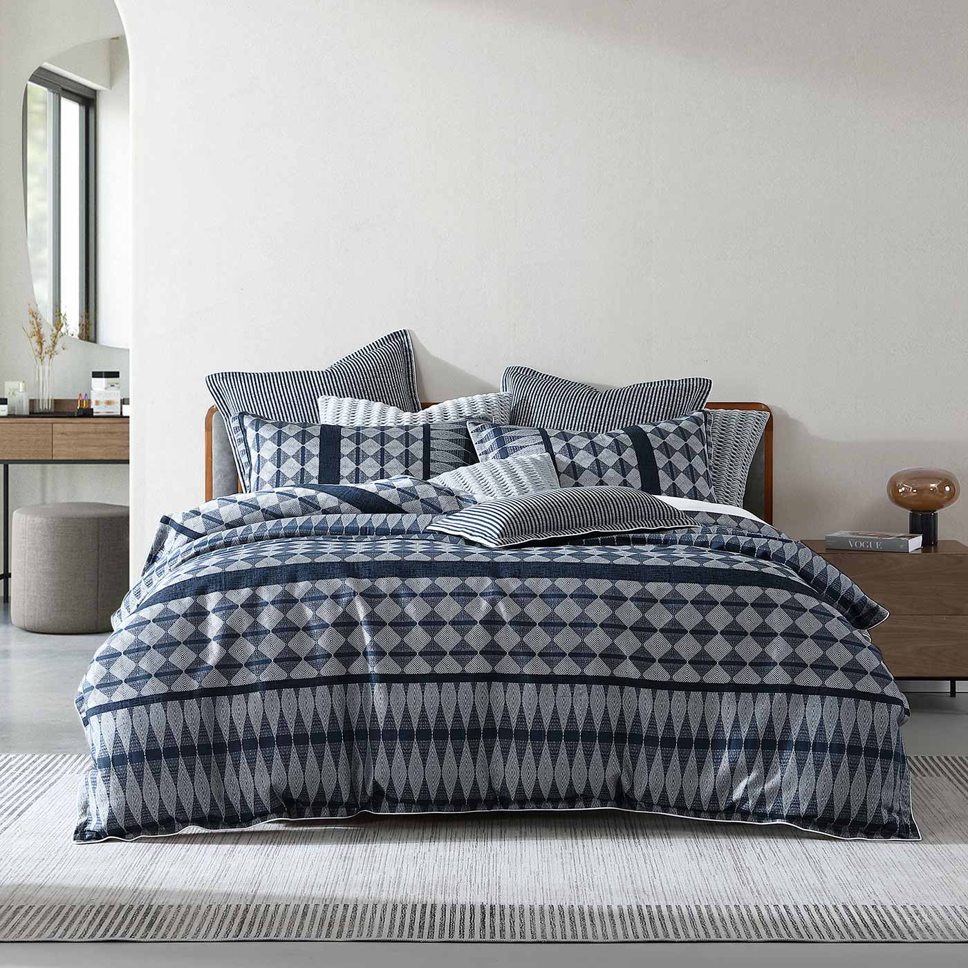 Classic stripes are woven with geometrics in this contemporary story. Boyd features industrial tones of slate blue and silver grey to create contrasting horizontal panels, the self-flange and cord piping giving a tailored finish.