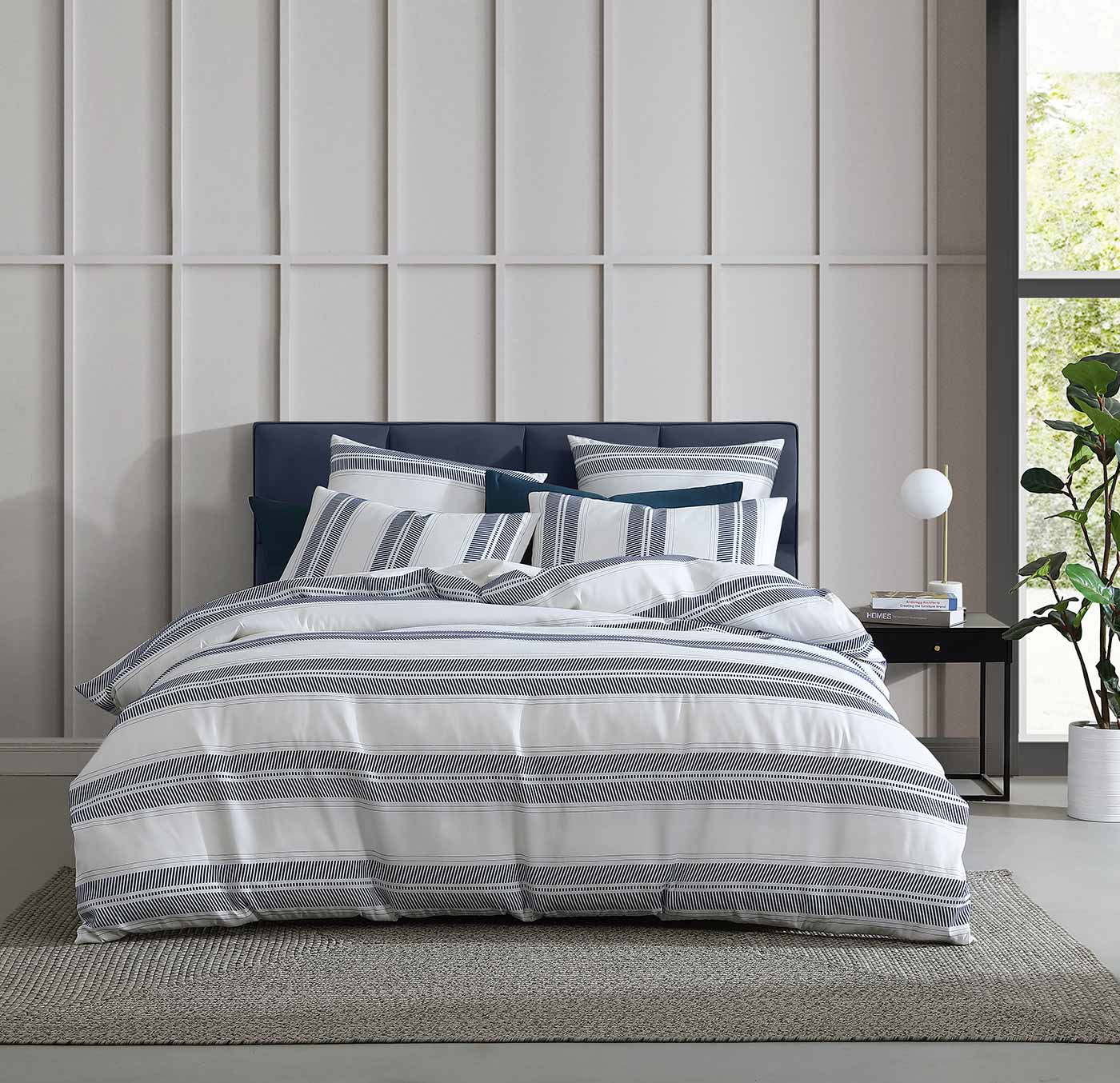The Cadet Navy Quilt Cover Set provides a relaxed, coastal look in a timeless navy hue. It features large textured stripes for an unmistakable summer feel. 