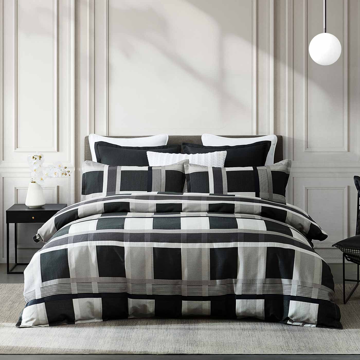 Conrad Silver imbues classic checks with a new attitude. The daring scale and urban palette seamlessly integrate into the contemporary home. Conrad’s European pillowcases feature a soft velvet reverse in silver. Simply turn them around to create a different look.