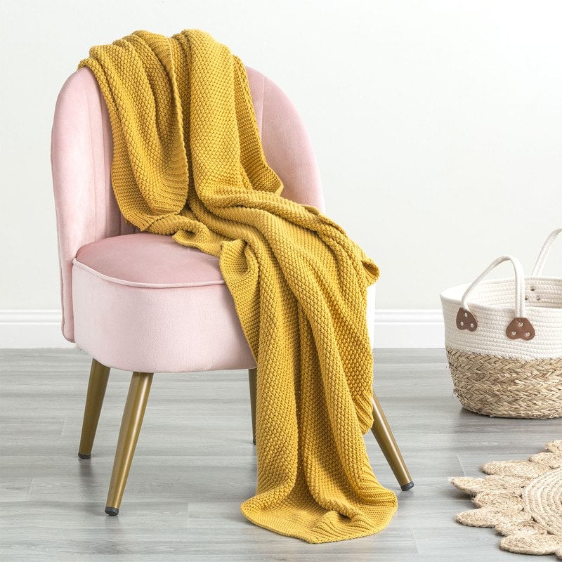 Indulge in the luxurious comfort of the Moss Seed Cotton Throw. Crafted with a supremely soft hand-feel, this throw offers a versatile color and texture that effortlessly enhances any space. 