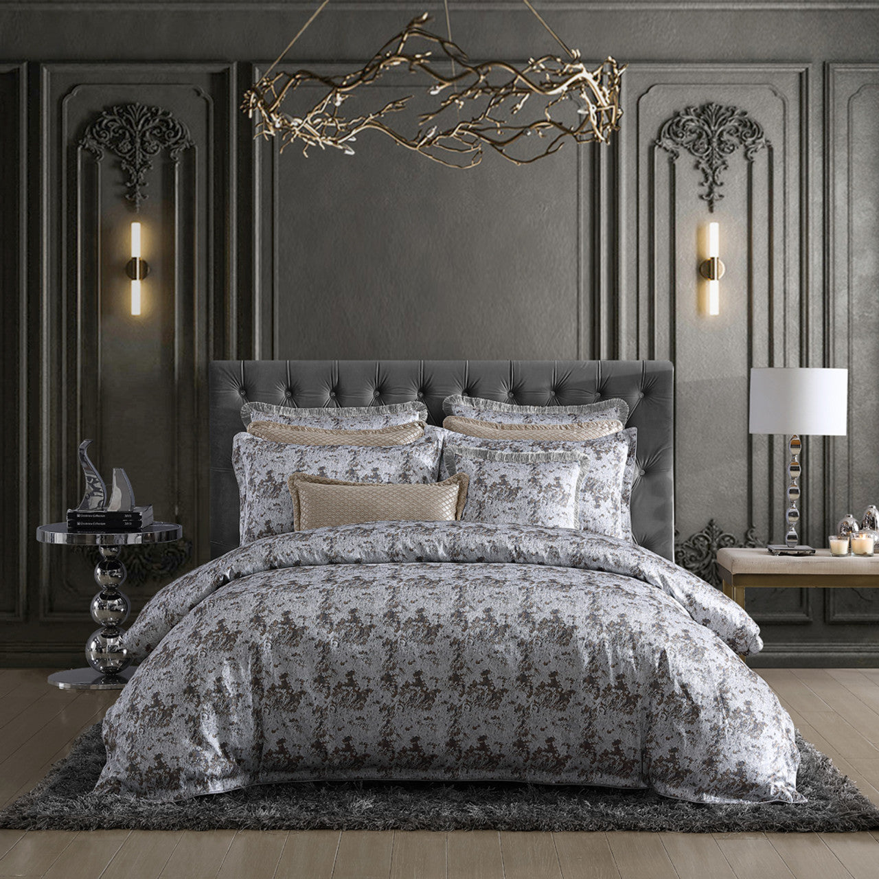 The Davinci Trieste Silver Bed Quilt Cover Set epitomizes modern luxury. Its jacquard weave seamlessly integrates metallic threads, creating a radiant shimmer and understated allure. The quilt cover and pillowcases are skillfully crafted with self-flanged edges, accentuated by cord piping, showcasing elegant tailoring. 