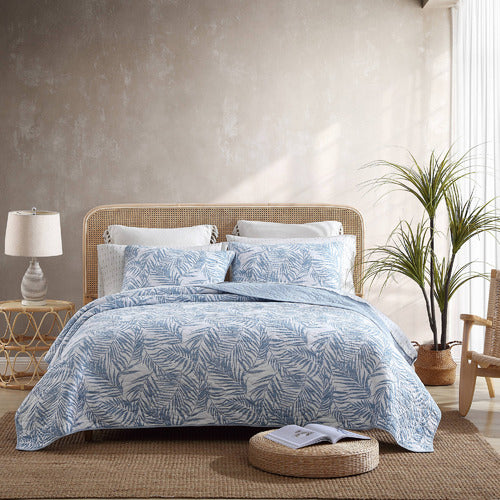 Transform your bedroom into a tranquil oasis with the Palm Day Coverlet set. Crafted with lightweight cotton and fully reversible, the set sports an all-over printed fern design in calming blue hues. 