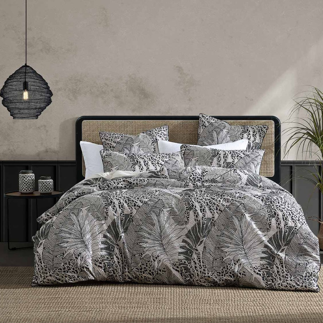 Borneo Haze is tropical bliss. Island foliage is printed on heat set crinkle fabric in monochromatic tones creating a dramatic effect. Borneo is elegantly finished with black cord piping to frame the design.