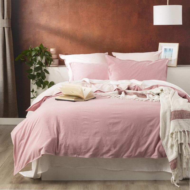 Create an effortlessly cool and inviting bedroom with the Rose Reversible Quilt Cover Set. Crafted from 100% cotton, this set from our Essentials Range offers a perfect blend of breathability and warmth, making it suitable for year-round use. The garment-dyed and stonewashed fabric gives it an airy, soft, and perfectly worn-in feel that will envelop you in comfort. 