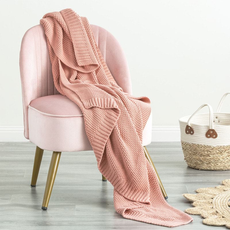 Indulge in the luxurious comfort of the Moss Seed Cotton Throw. Crafted with a supremely soft hand-feel, this throw offers a versatile color and texture that effortlessly enhances any space. 