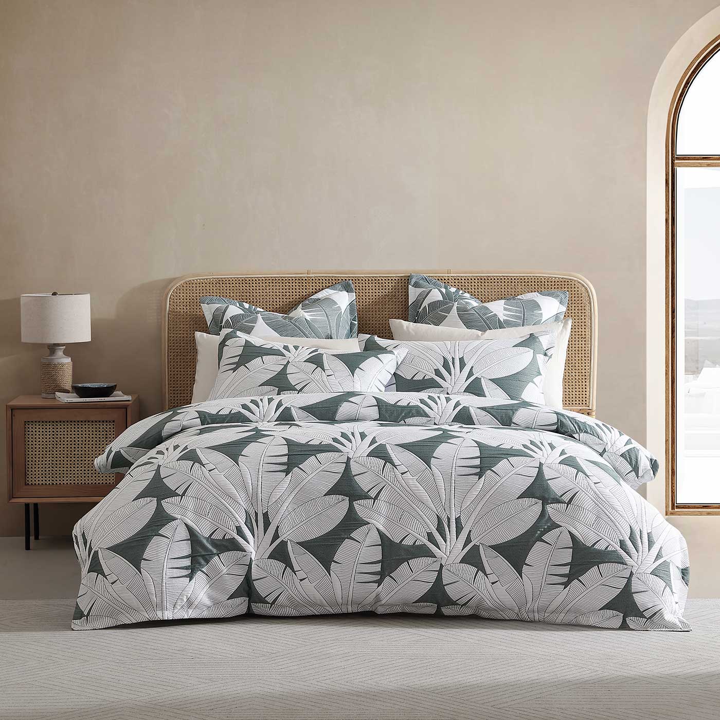 Bring a tranquil island getaway to your bedroom with the Lagos Olive Quilt Cover Set. Anchored by a lush olive ground, its large-scale white banana leaf pattern creates a bright and vibrant oasis.
