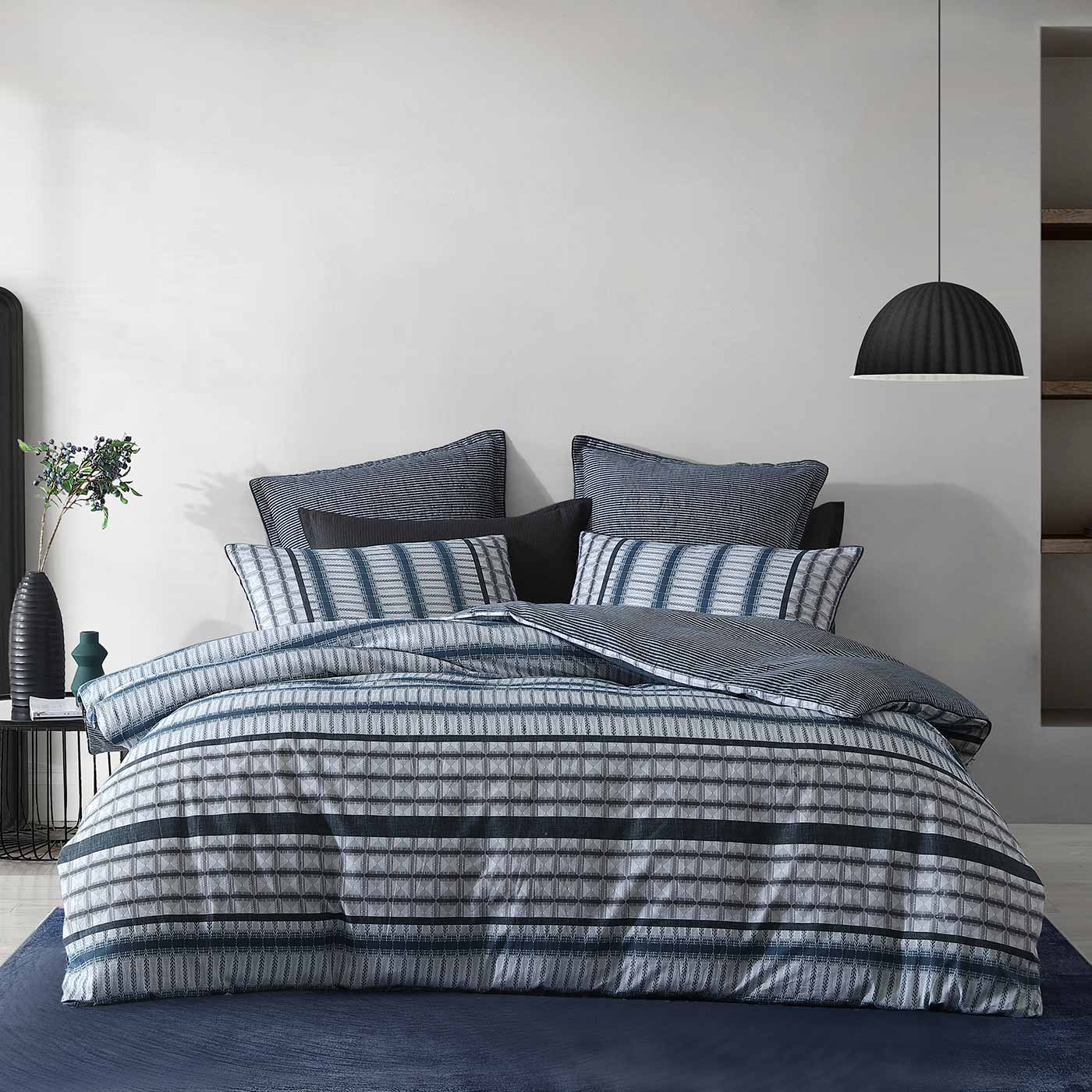 Experience a modern, contemporary look with the Mason Indigo Quilt Cover Set. Featuring highly detailed geometric patterns in shades of indigo and grey