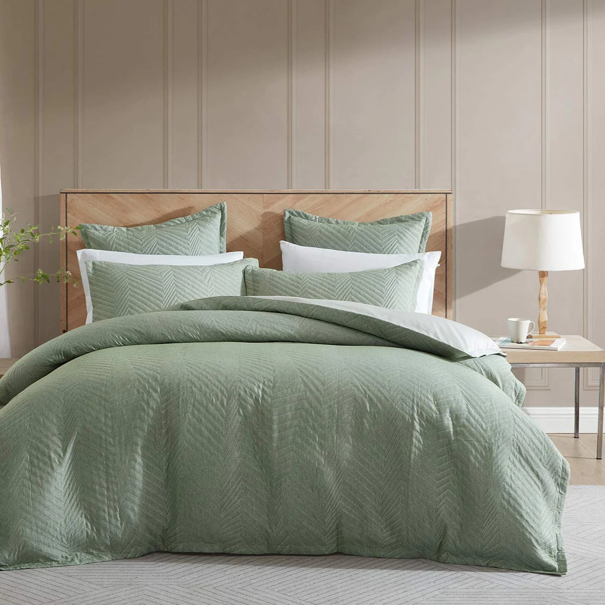 Embrace the elegant simplicity of Monty Eucalyptus, a bedding masterpiece. This stunning design showcases asymmetrical vertical stripes artfully manipulated into a charming skewed chevron pattern. 
