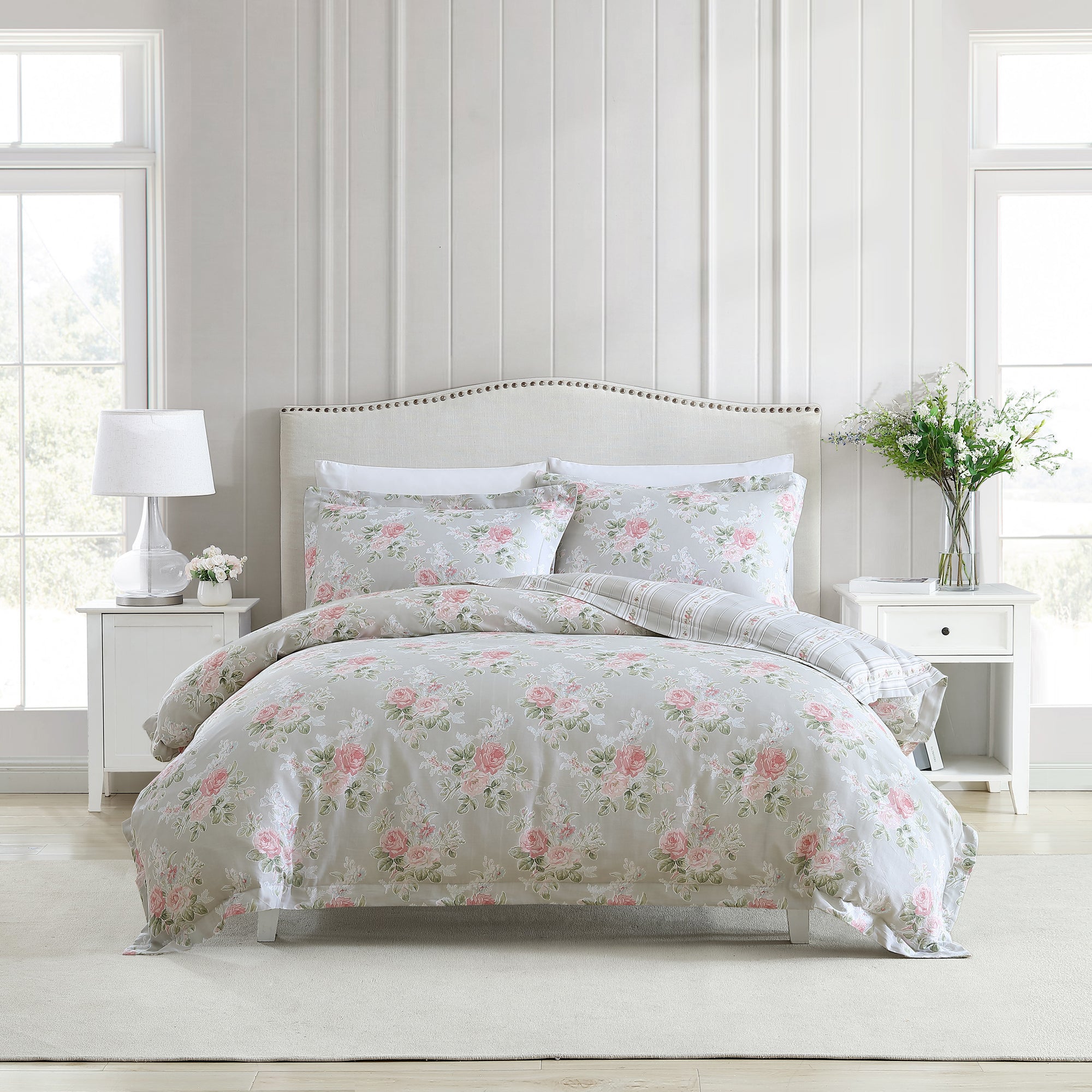 The Melany Quilt Cover Set Range Pink and Grey by Laura Ashley is constructed from 100% cotton sateen fabric. Transform your bedroom with this romantic rose design, pairing classic dove grey with a beautiful pop of pink. Featuring a tailored edge and coordinated with an elegant wallpaper stripe reverse, this timeless classic fits easily into any bedroom.