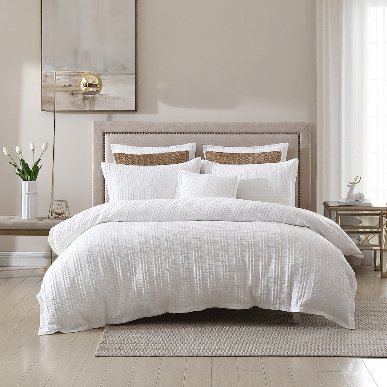 Experience timeless sophistication with the Private Collection Winton White Bed Quilt Cover Set. This exquisite collection showcases a captivating geometric jacquard design that exudes elegance. The Winton set is tastefully embellished with a self-bordered flange, adding a touch of refinement and creating a visually striking tailored appearance.