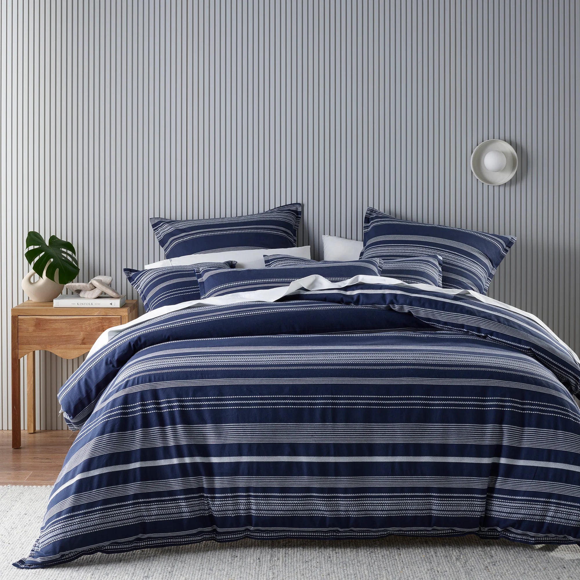 Instantly relax this winter with Regent. A luxuriously textured cotton fabric that is dyed in an elegant navy-blue colour with contrast woven white stripes. Complete the look with our matching european pillowcases and cushions.