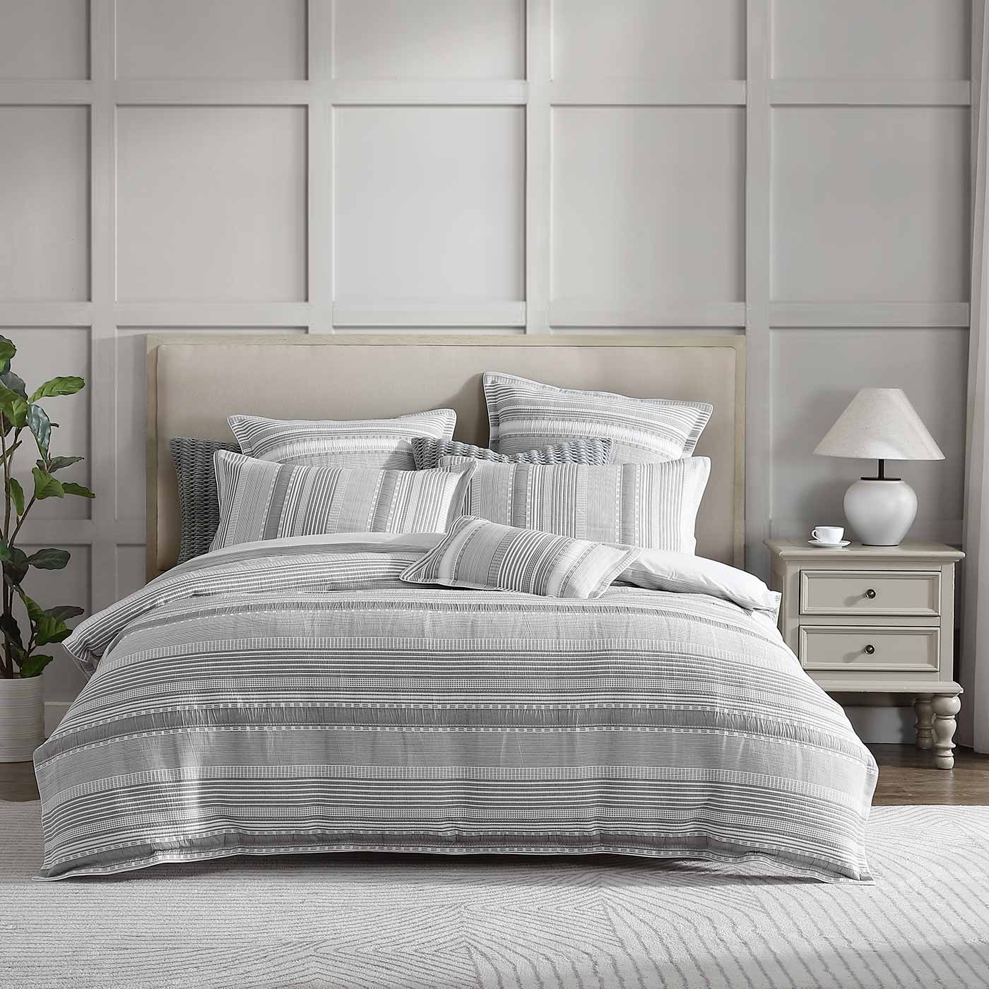 Sinclair Silver combines a modern coastal look with the tactile softness of quilted matelasse. A series of horizontal stripes alternate between plains and patterns balanced by the fresh, tonal palette. Self-flanged and piped edges complete the look.