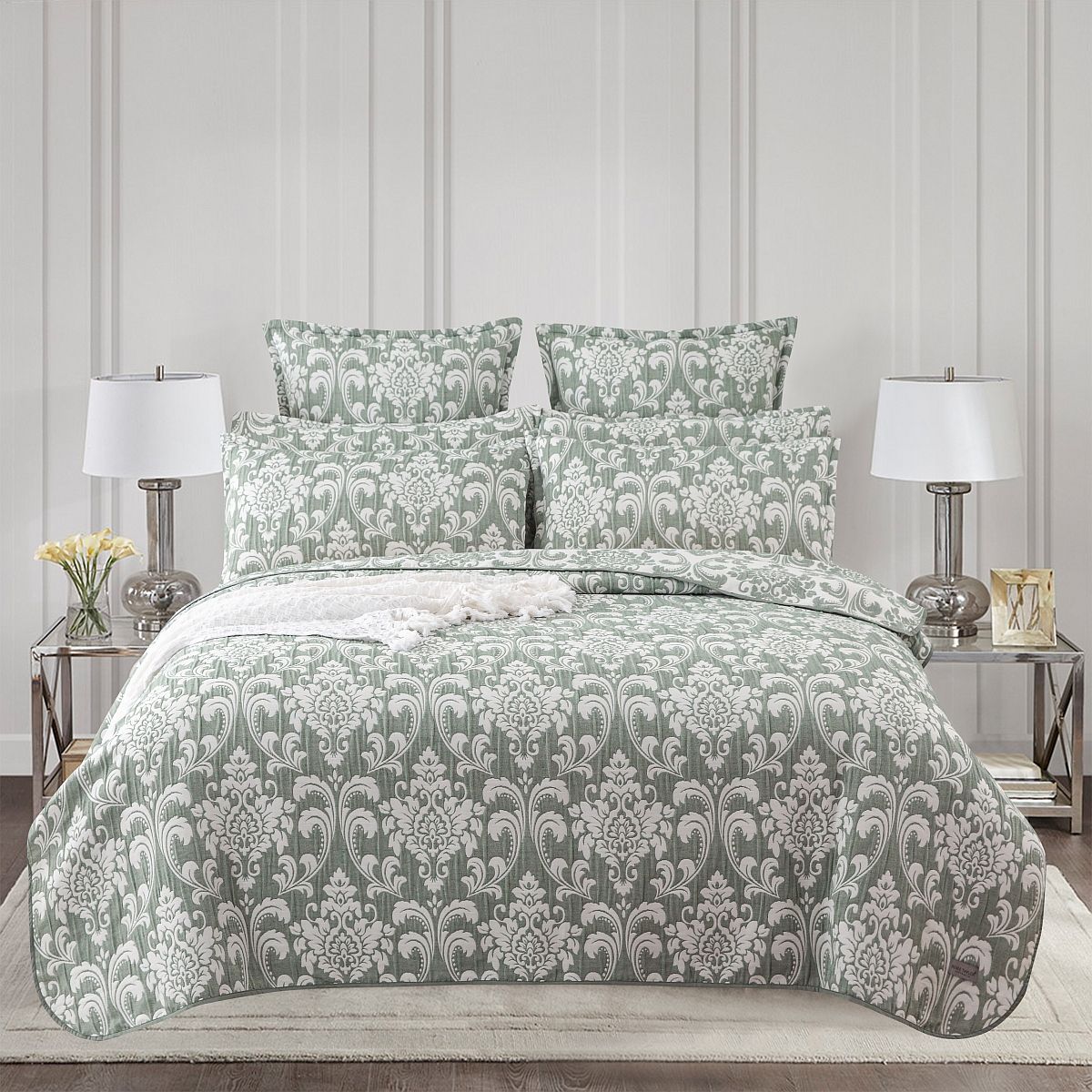 Boasting a timeless jade & white damask pattern, highlighted by sharp, straight piped edge detailing, this bedspread features a reverse side equally elegant & detailed. Whether you're looking for a light and airy summer layer or wish to layer it with a quilt for winter warmth, this bedspread provides the flexibility to effortlessly shift between seasons. 