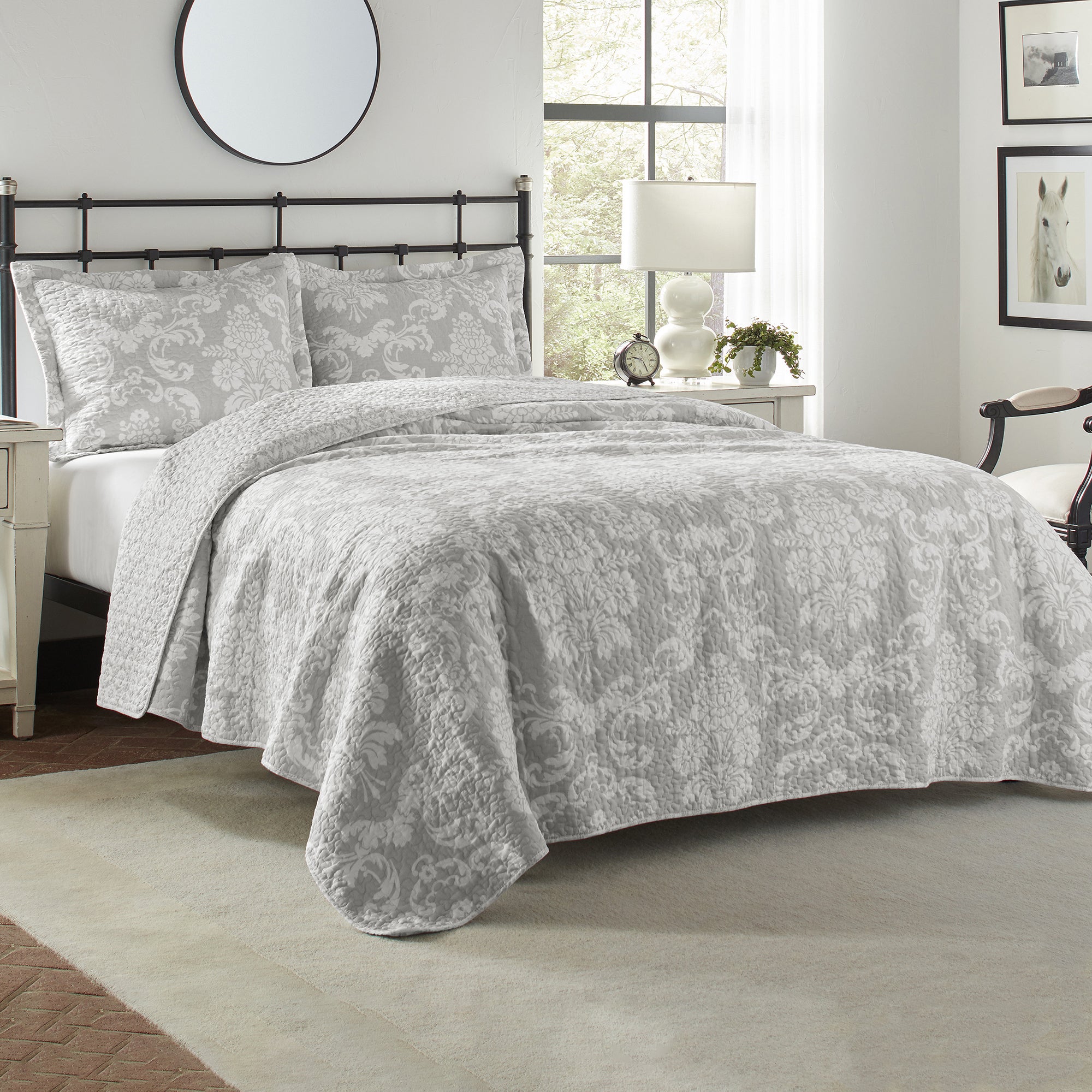 The Venetia Coverlet Set Grey by Laura Ashley is a modern interpretation of a classic damask design and features a grey ground with an ivory damask quilt.