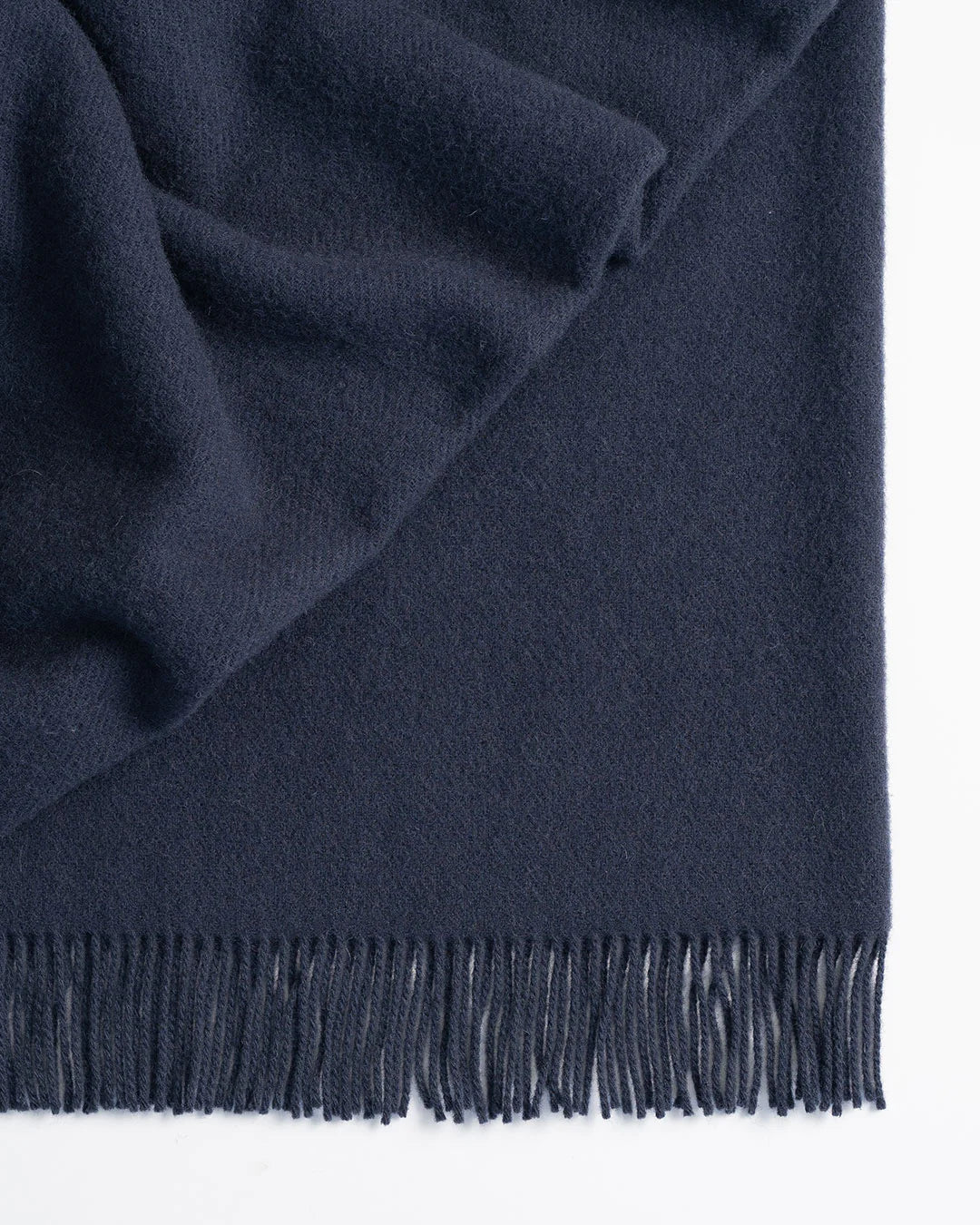 Made from 100% New Zealand lambswool, Nevis throw blankets in Navy are simply luxurious. All of our throws make the perfect companion over cooler days and nights, and can also be enjoyed outdoors