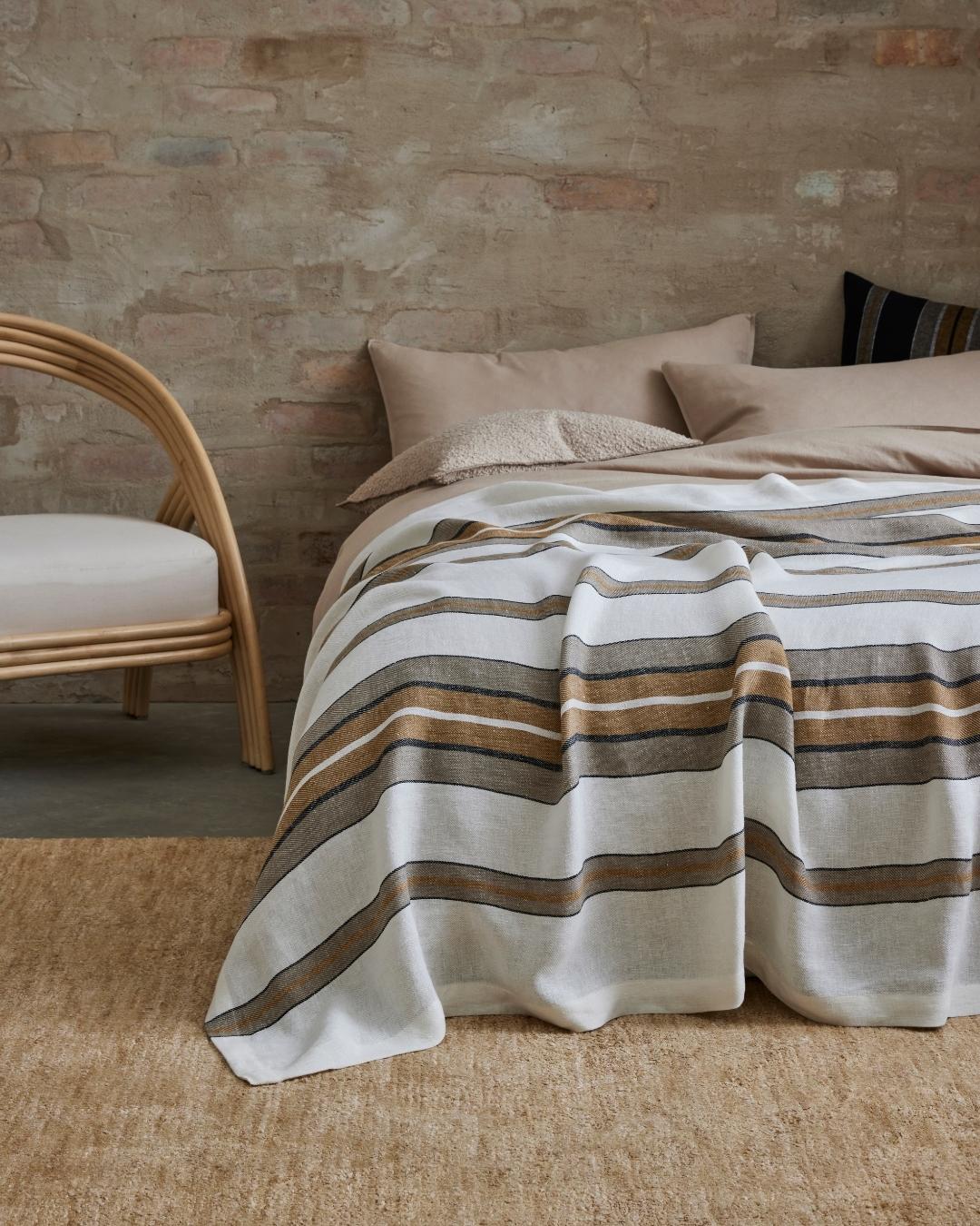 Franco throw in amber is made from 100% linen.  The Amber colourway of Franco will bring a touch of warmth and sunshine into any room.