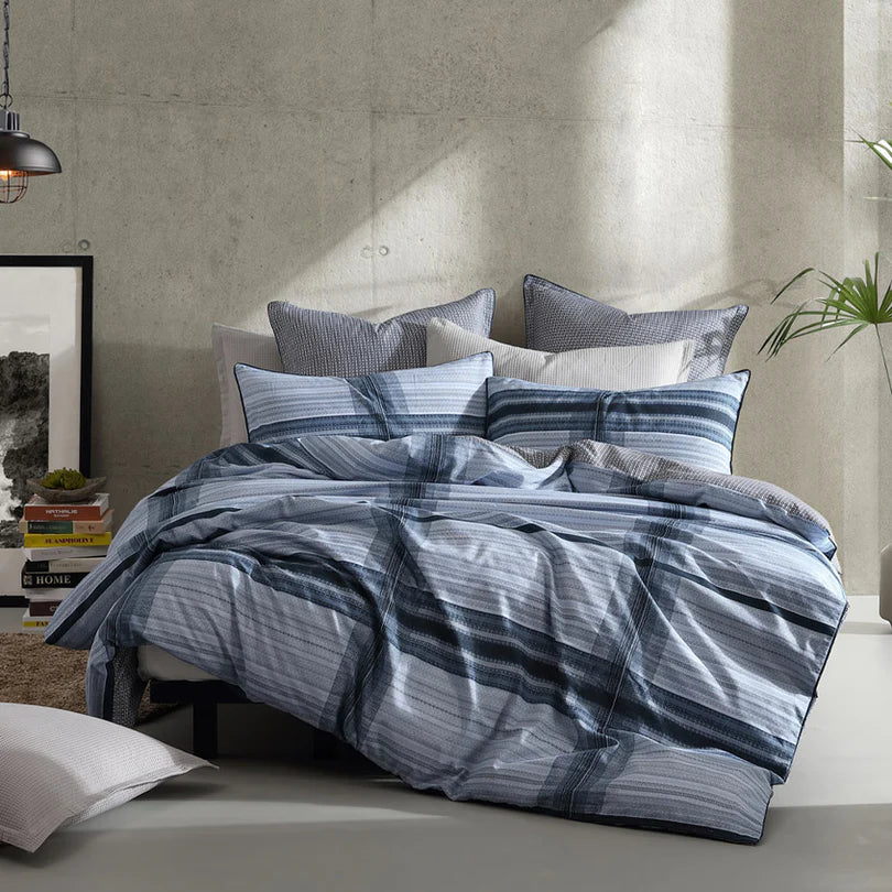 Experience the timeless charm of the Georgio Quilt Cover Set Range Navy by Logan and Mason, where the beloved check pattern takes center stage in this classic everyday design.