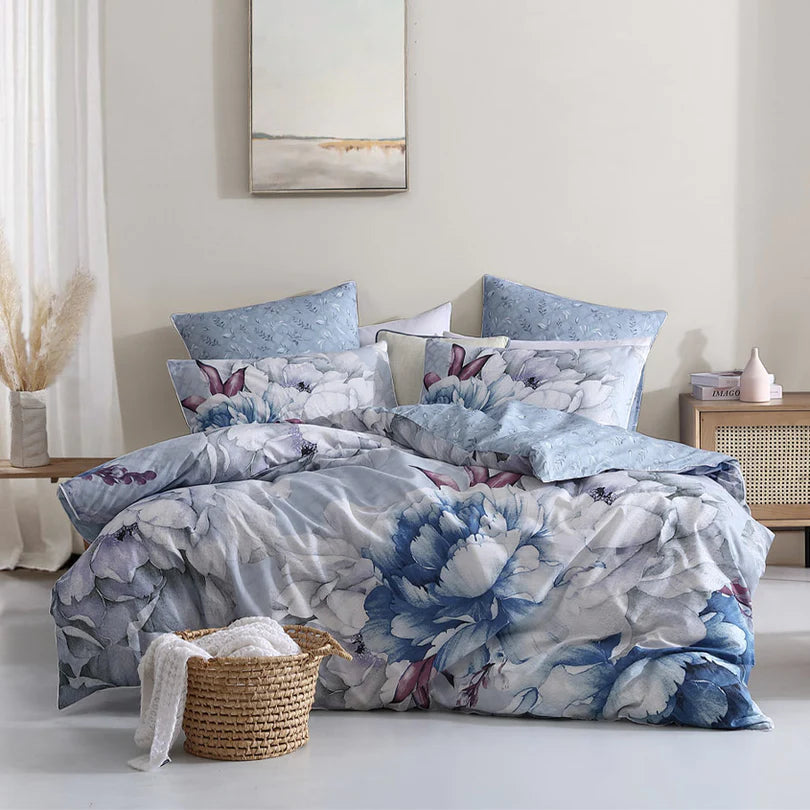 Indulge in the serene beauty of the Liv Quilt Cover Set Range Silver by Logan and Mason as it welcomes you to a winter wonderland of silver, mauve, and icy blues.