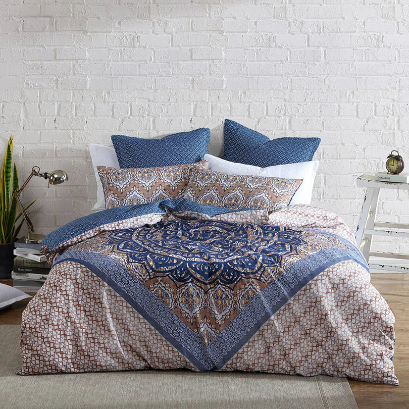 Embrace a world of exotic patterns and global design influences with the Melia Quilt Cover Set Range Indigo by Logan and Mason. This captivating bedding set is a perfect choice for those seeking to showcase their bohemian style and make a bold statement in their sleeping space.