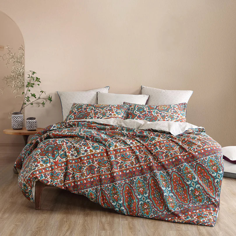 Immerse yourself in the indie bohemian origins of the Rami Quilt Cover Set Range Vintage by Logan and Mason, evoking memories of worldly travels. 