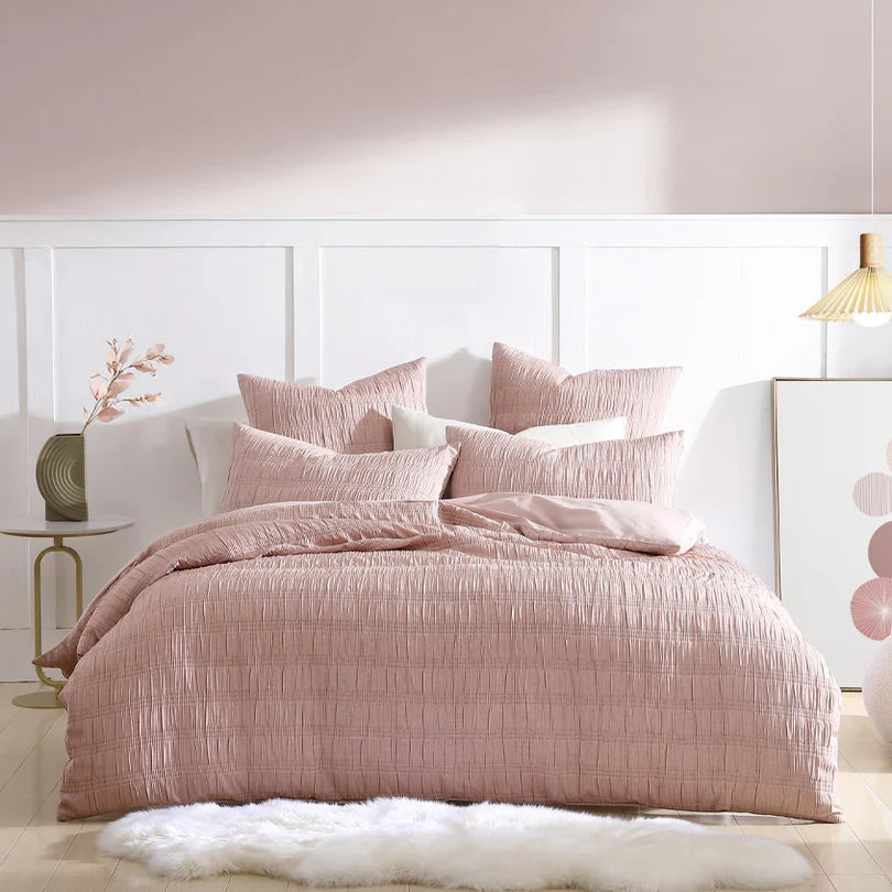 Indulge in pure comfort and embrace the casual simplicity of the August Quilt Cover Set Range Dusk by Logan and Mason Platinum. This exquisite bedding set invites you to unwind and relax, enveloped in its serene ambiance. 