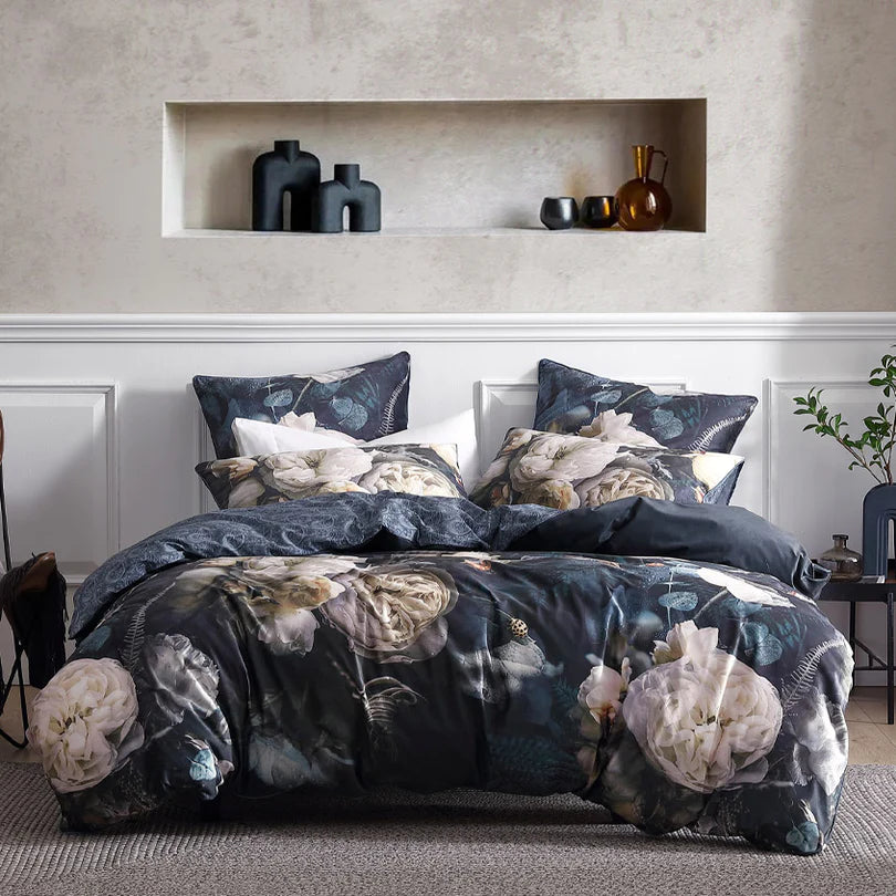 Experience the breathtaking beauty of the Belezza Quilt Cover Set Range Night by Logan and Mason Platinum, where stunning florals meet sumptuous tactile qualities. This exquisite bedding set features divine soft velvet adorned with large-scale blooms, evoking a sense of moody allure in a winter palette. 