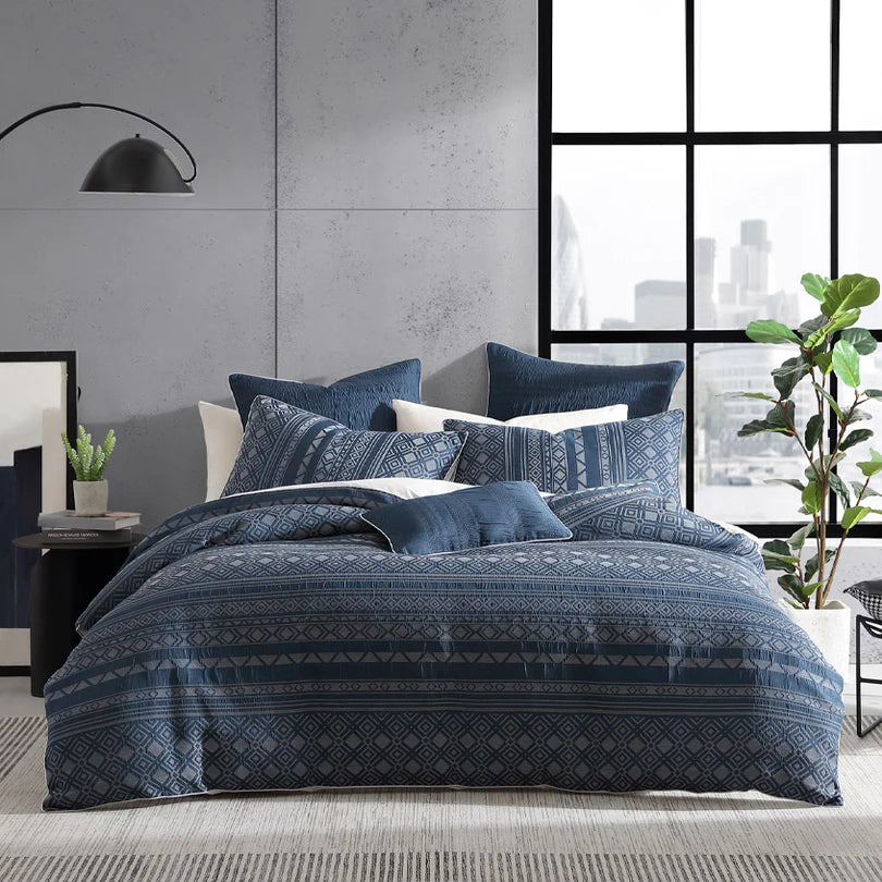 Experience the untamed and adventurous spirit with the Logan and Mason Platinum Orlando Quilt Cover Set Range in Indigo. Orlando harmoniously combines a diverse collection of geometric patterns infused with the captivating essence of Moroccan design, all presented in a captivating color palette of indigo and linen.